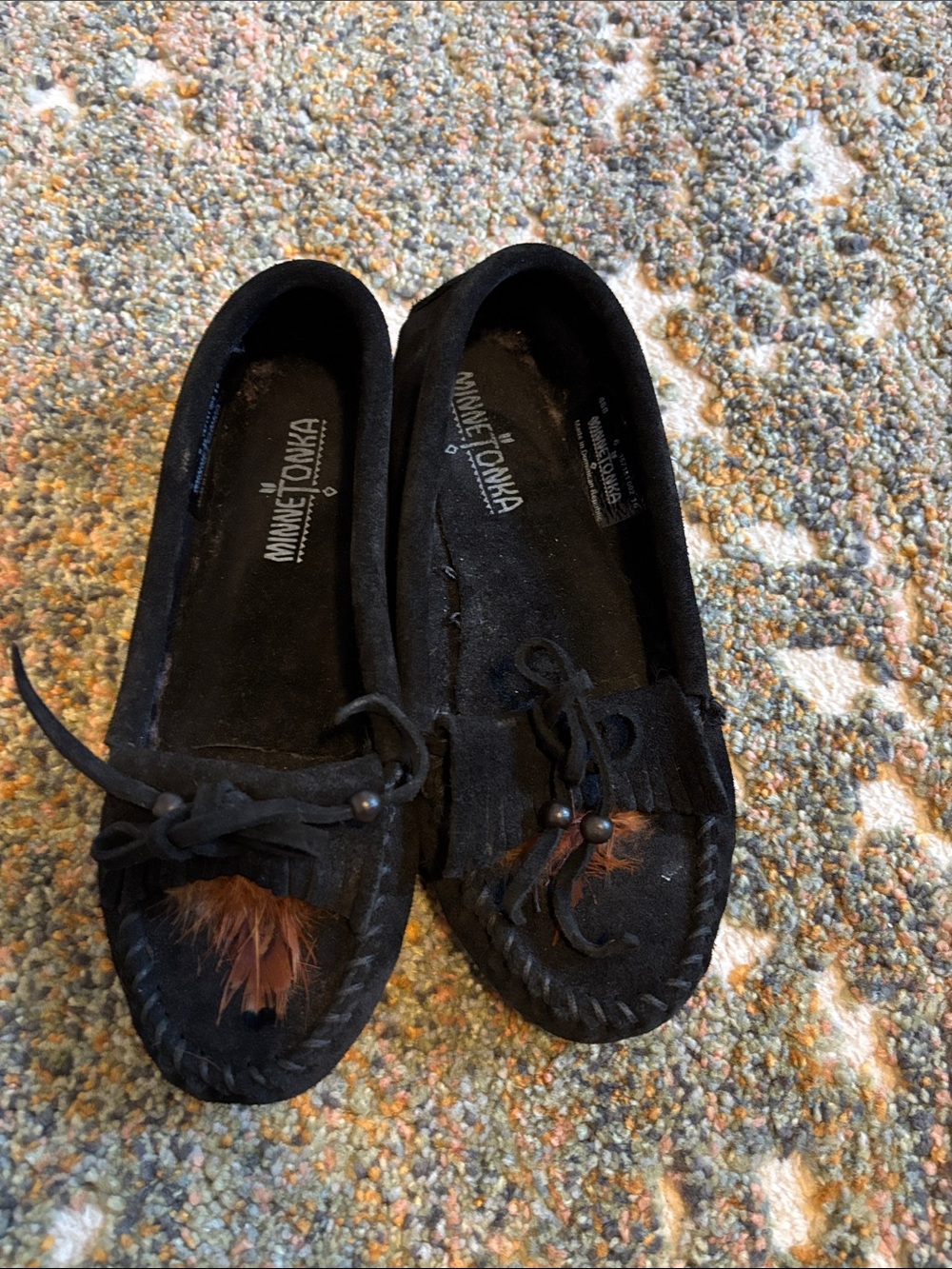 NEVER WORN. Minnetonka Black Suede Moccasins with Brown Feather Trim